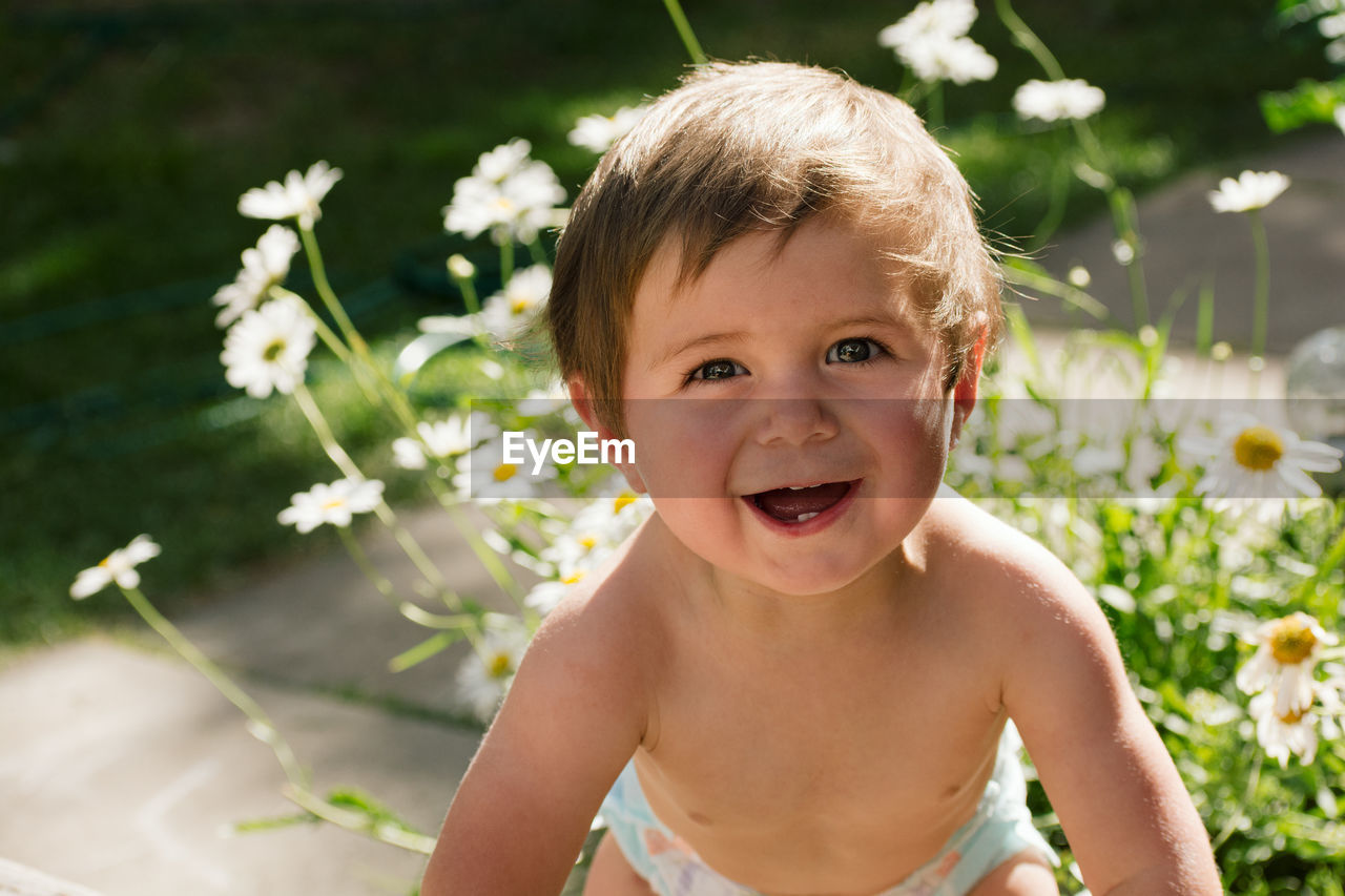 Smiling baby boy looking at camera