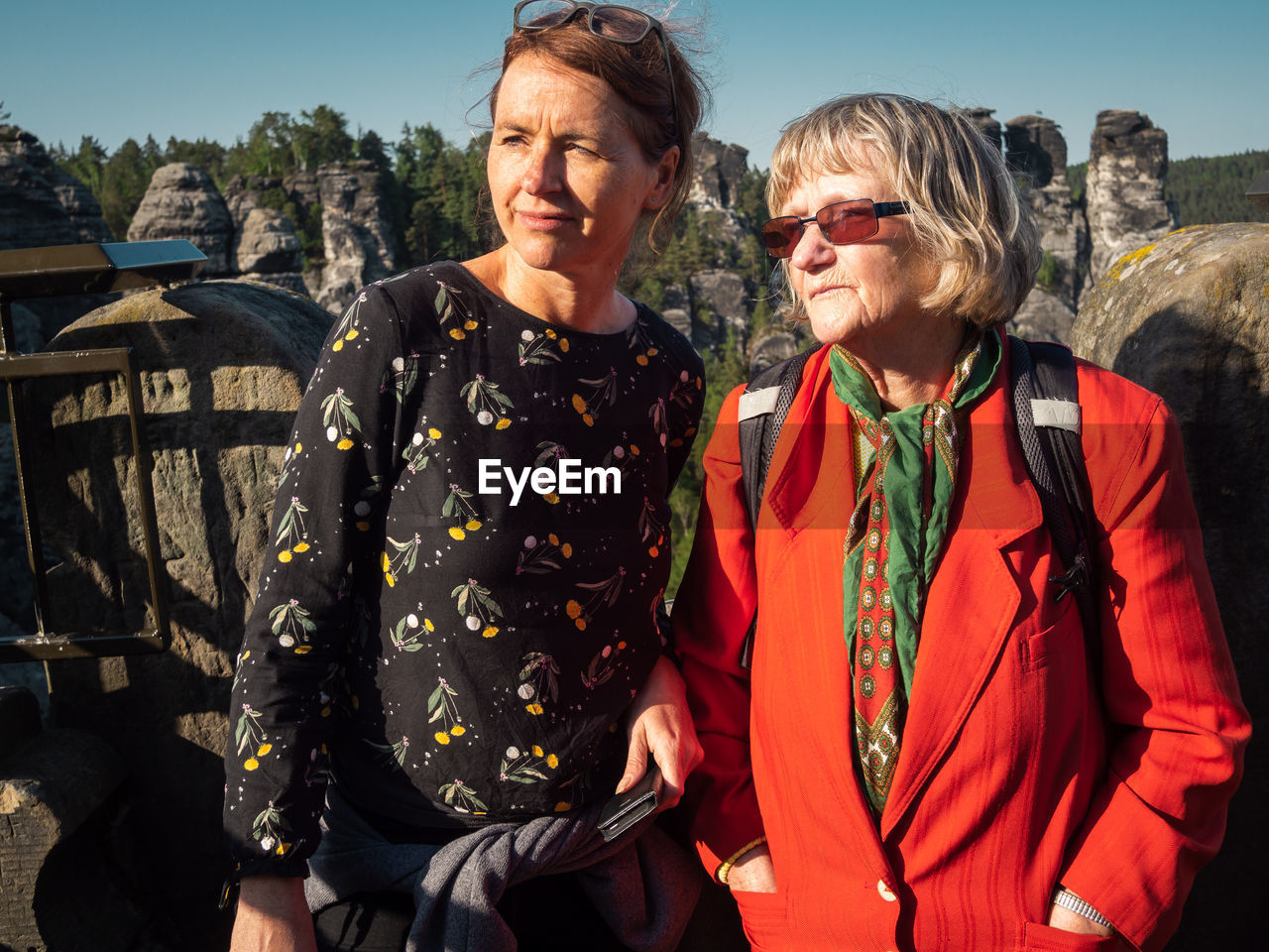 Women standing in front of old ruin