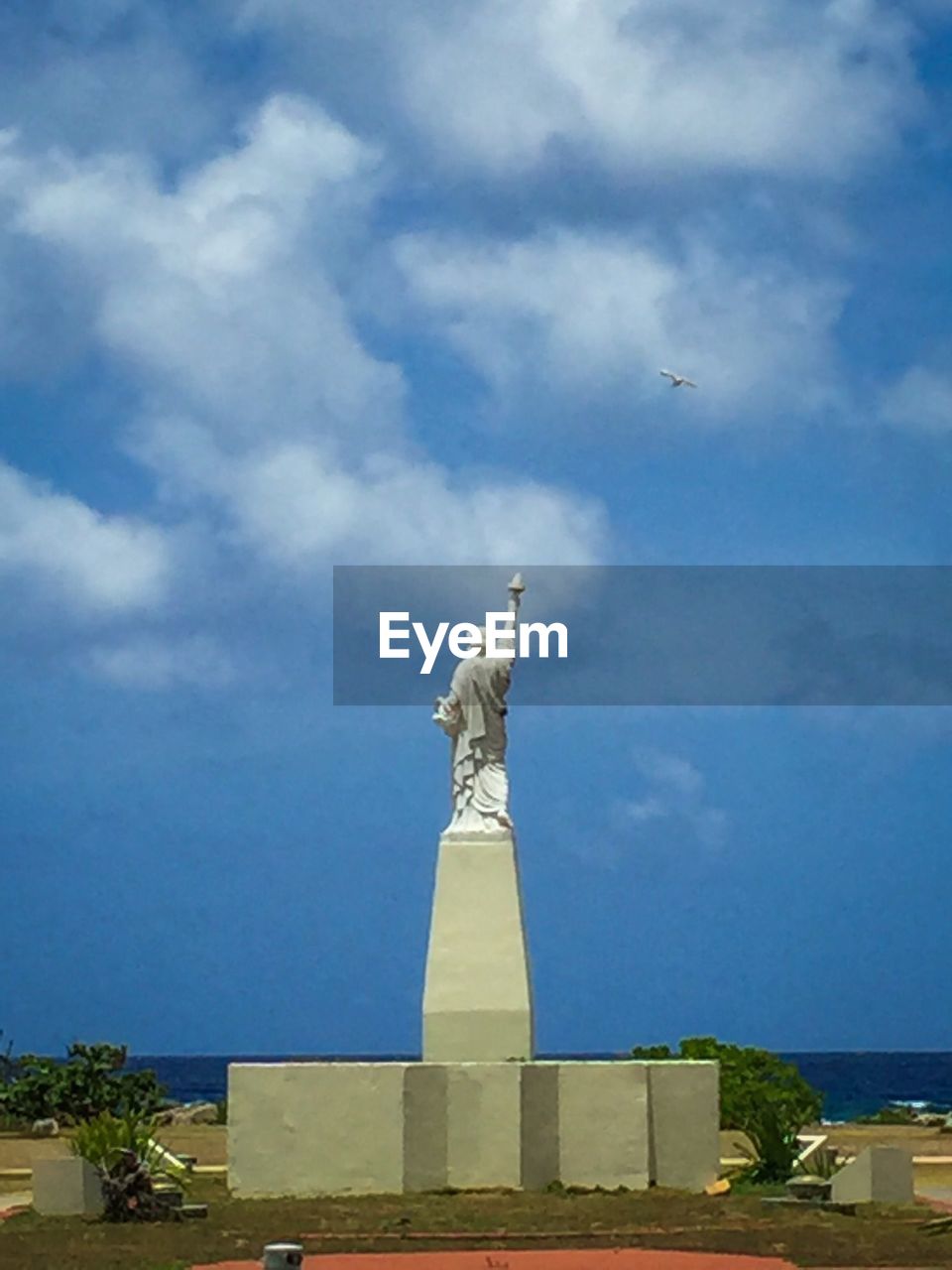 LOW ANGLE VIEW OF BUILT STRUCTURES AGAINST BLUE SKY