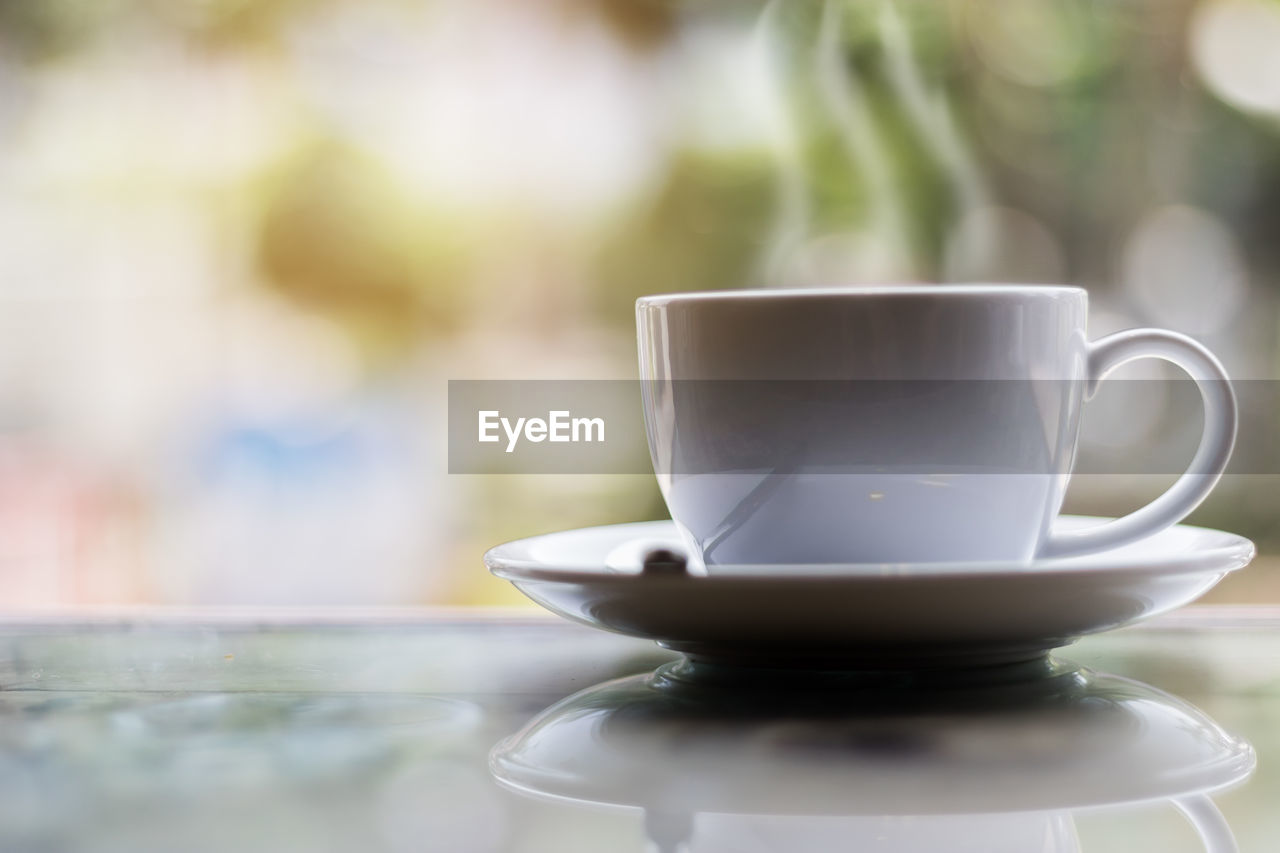 Close-up of coffee cup on table