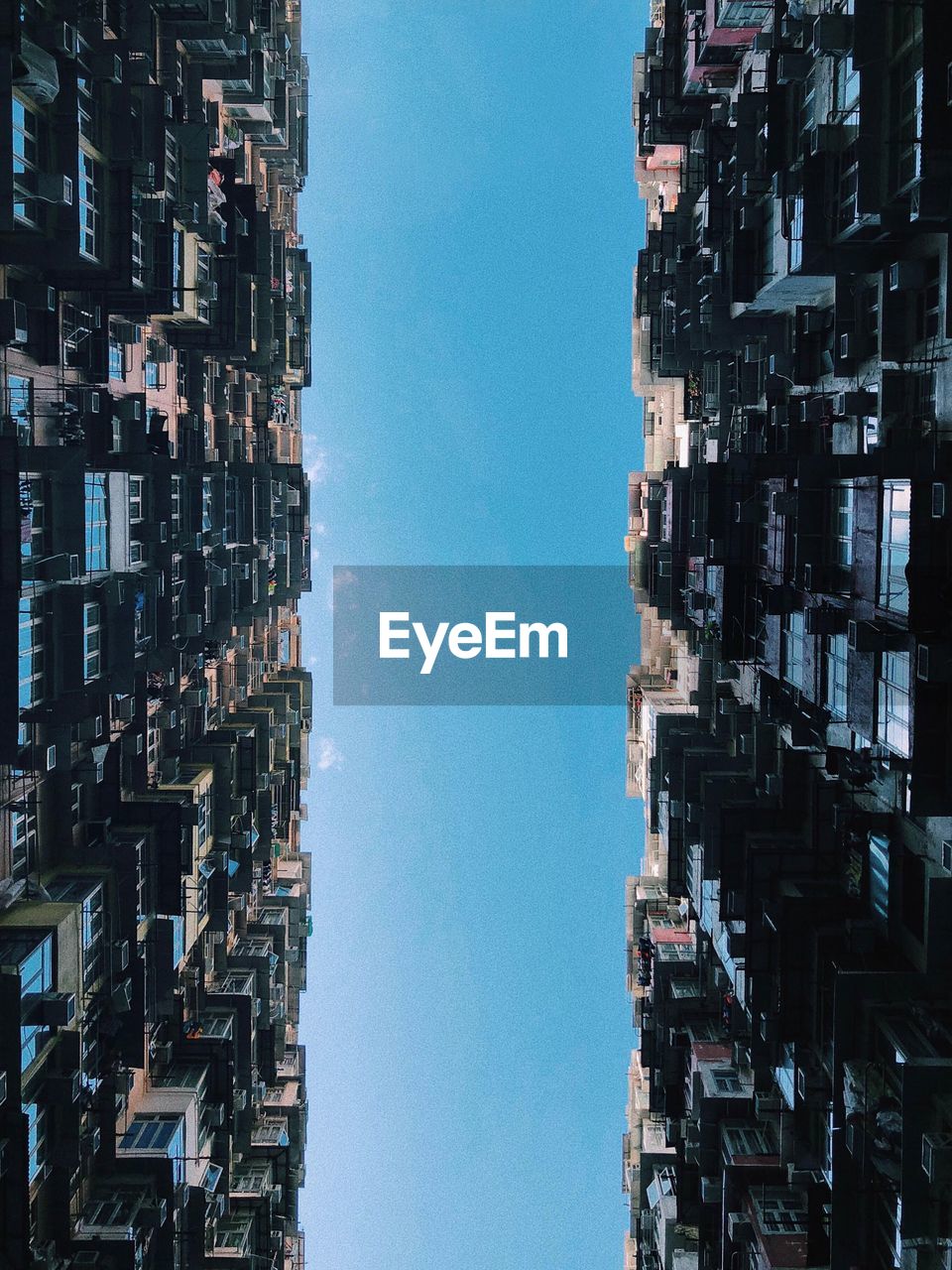 Low angle view of buildings against blue sky