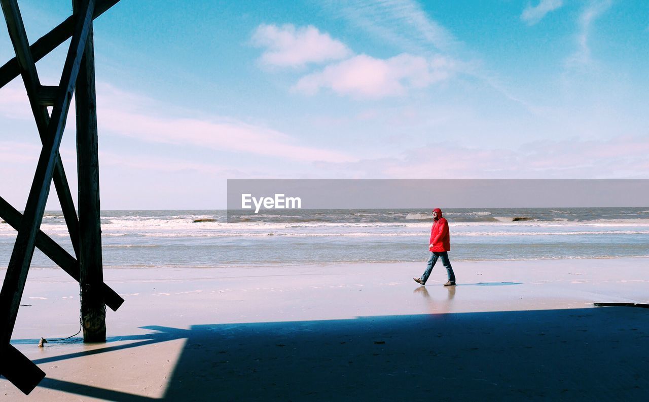 WOMAN STANDING ON SHORE