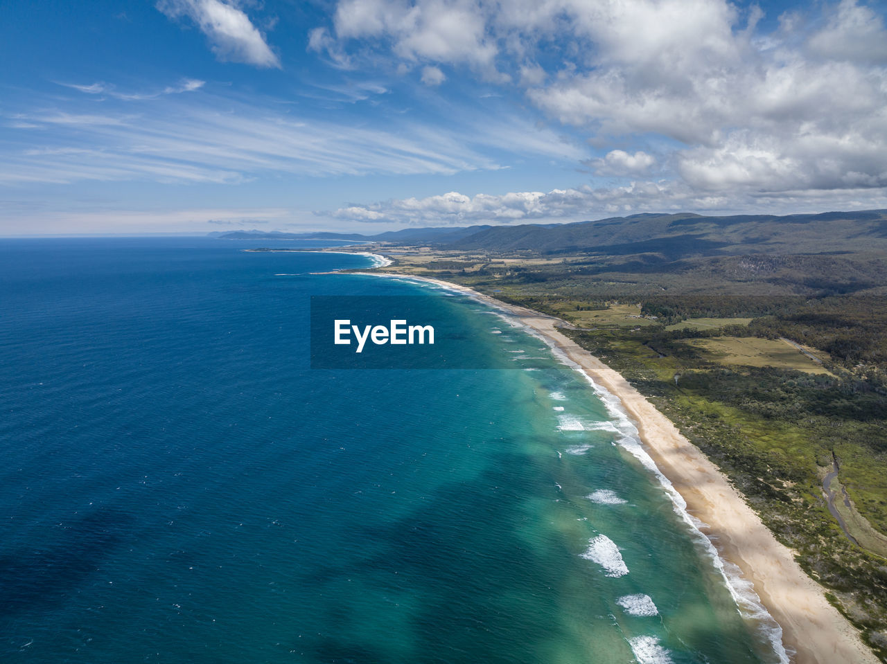 Aerial drone view of lagoons beach conservation area and a3 tasman highway, east coast of tasmania