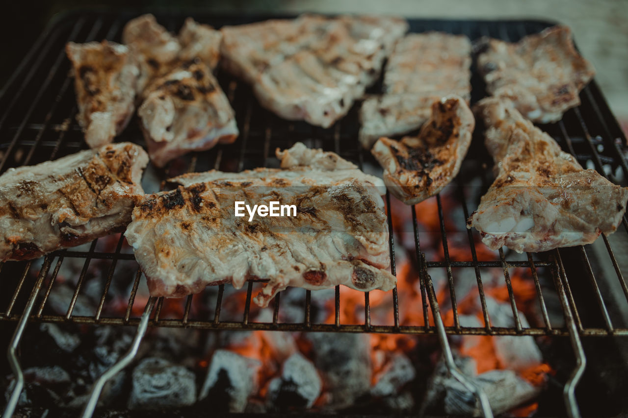 High angle view of meat on barbecue grill