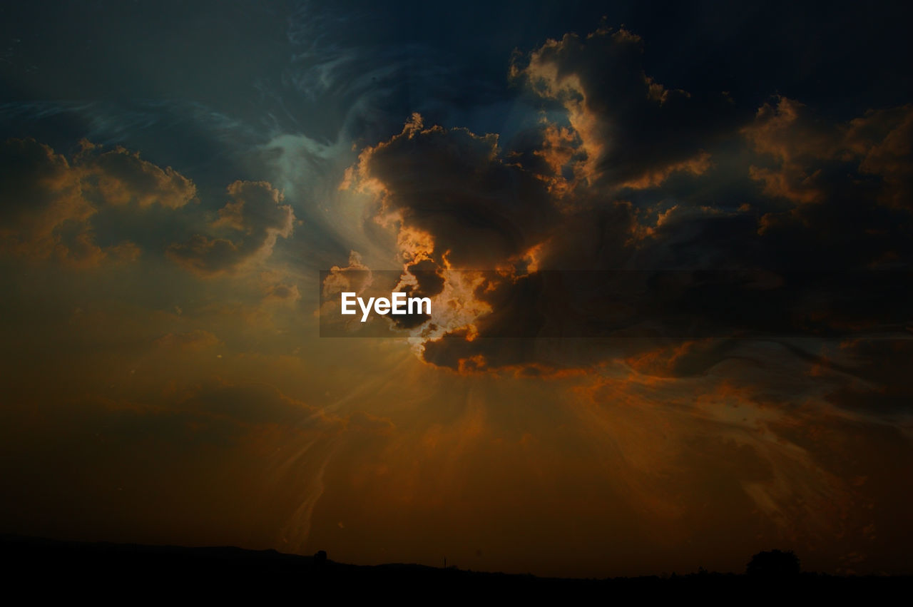 Low angle view of dramatic sky at sunset