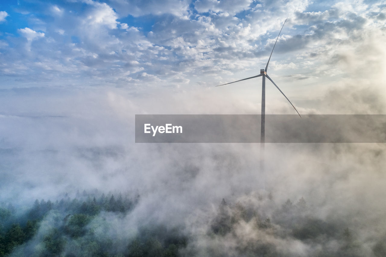 Germany, baden-wuerttemberg, schurwald, aerial view of wind wheel and morning fog