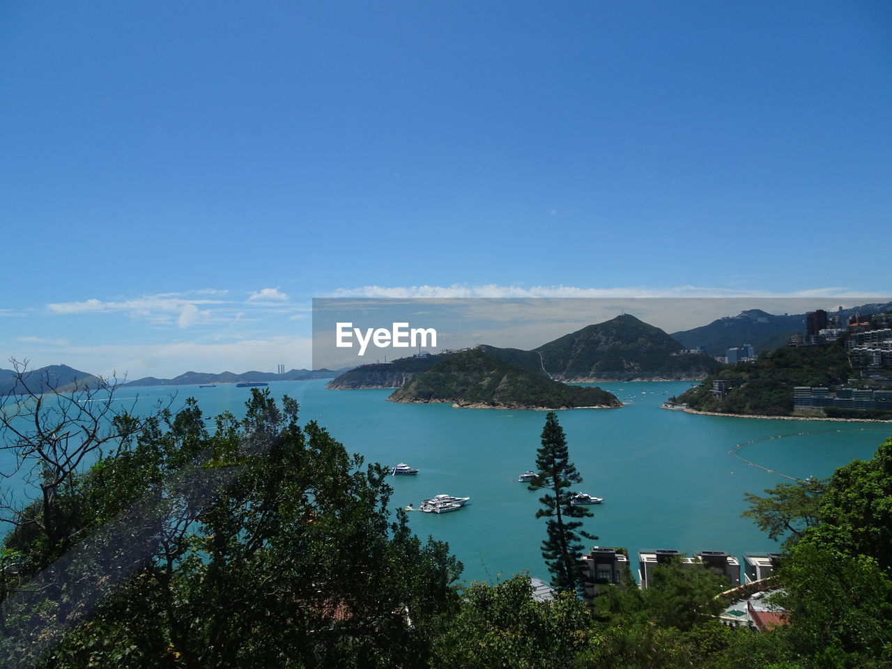 SCENIC VIEW OF LAKE AND TREES AGAINST BLUE SKY