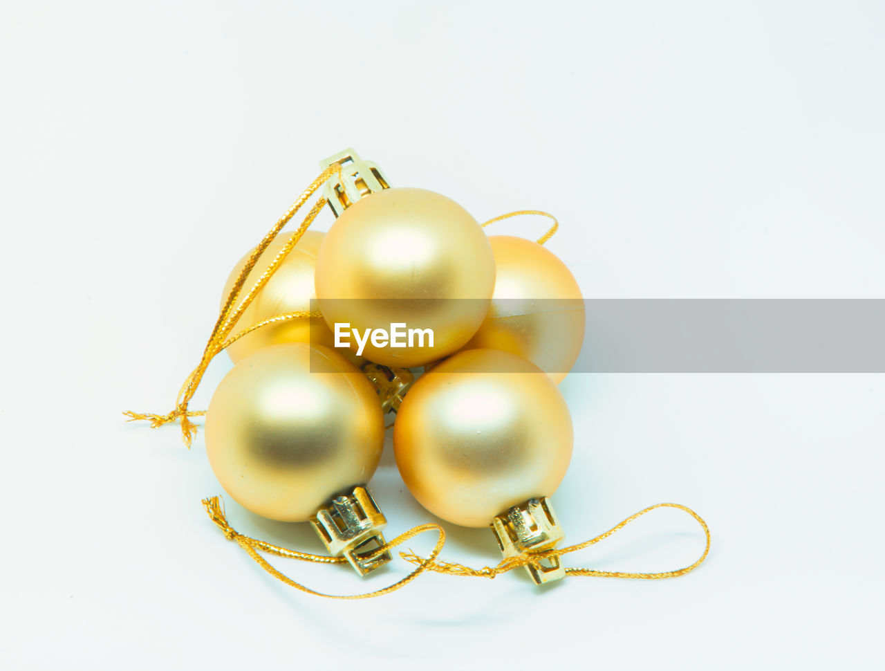 High angle view of christmas balls against white background