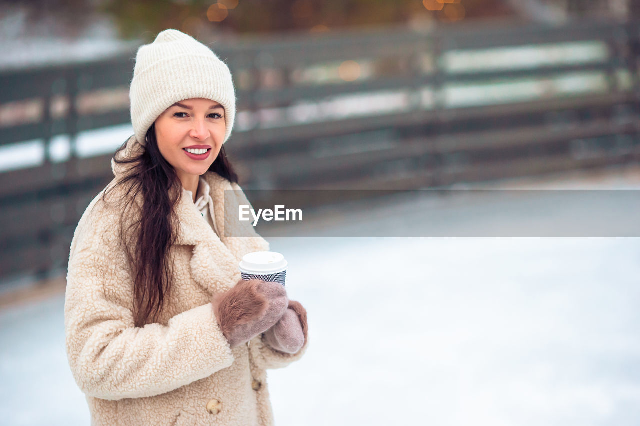 portrait of young woman wearing warm clothing