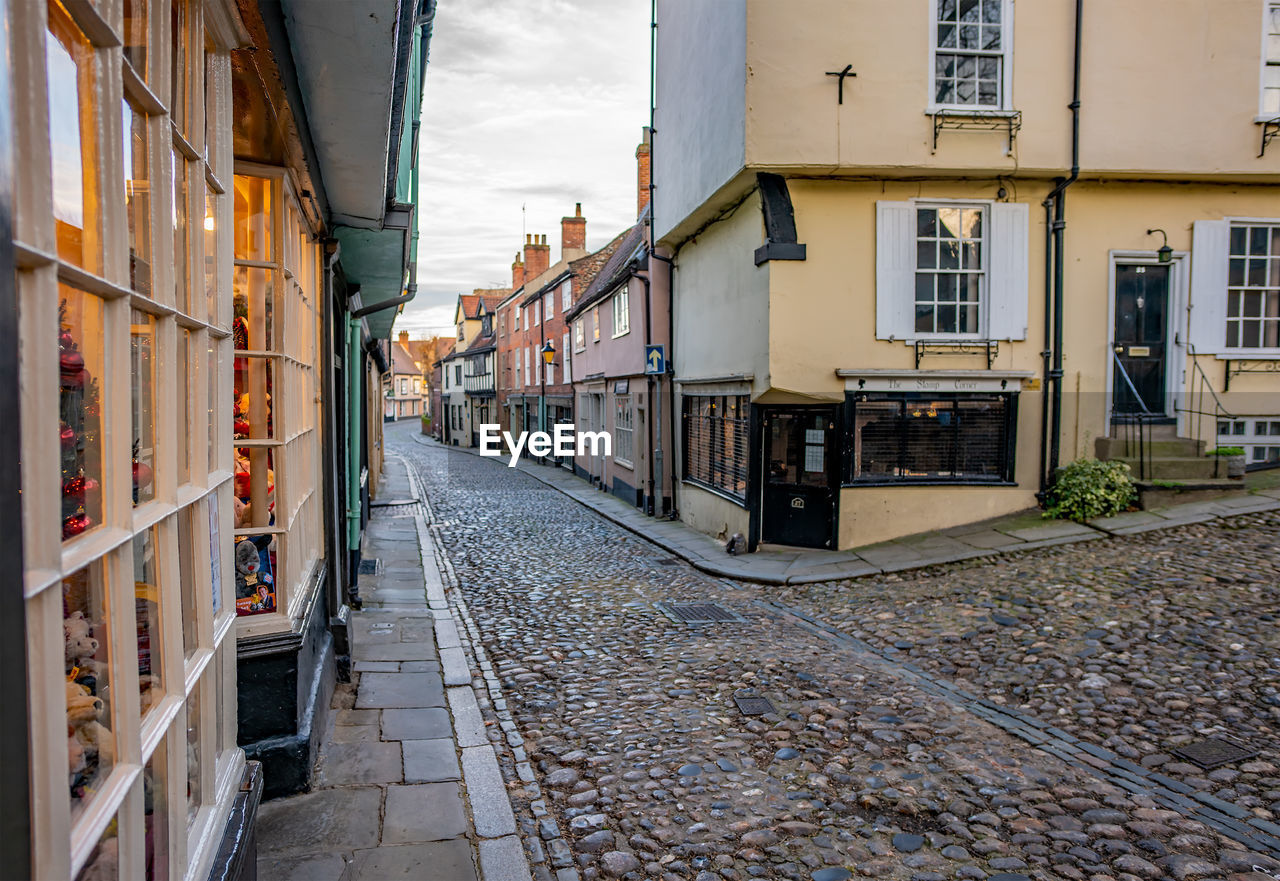 STREET AMIDST BUILDINGS IN CITY