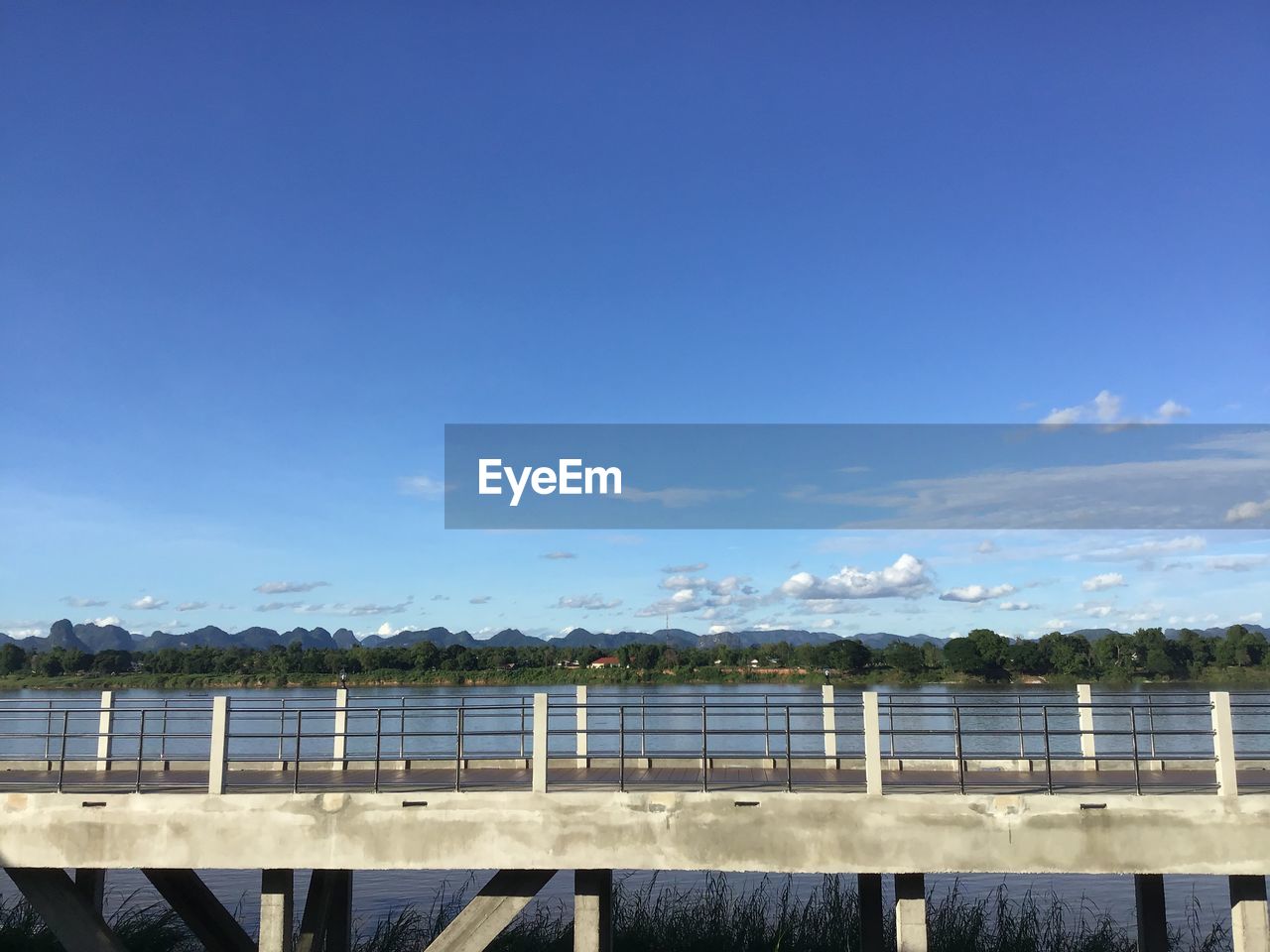 Scenic view of lake against blue sky