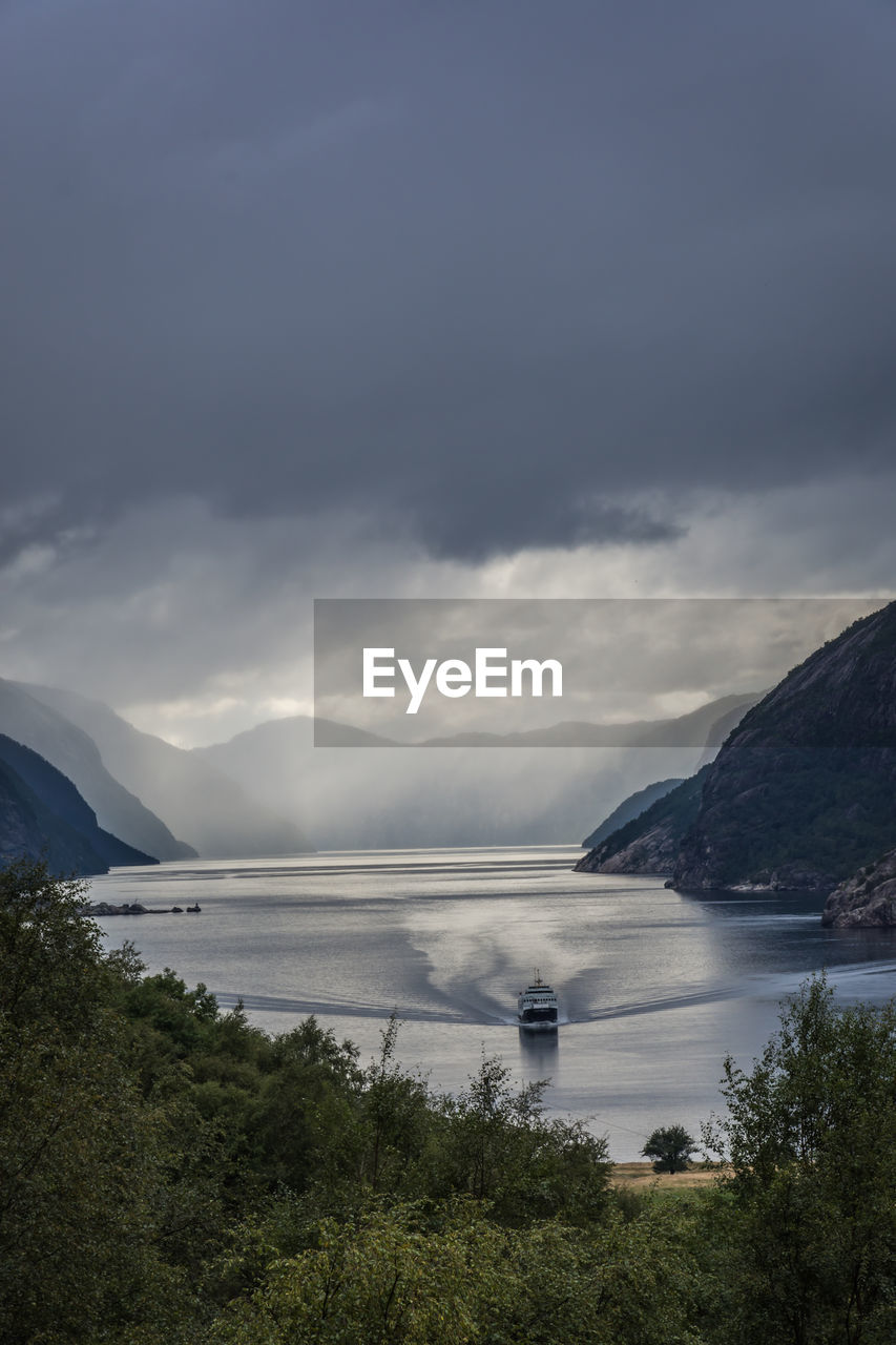Scenic view of fjord against sky