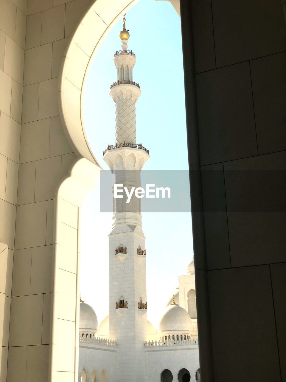 LOW ANGLE VIEW OF BELL TOWER IN CITY