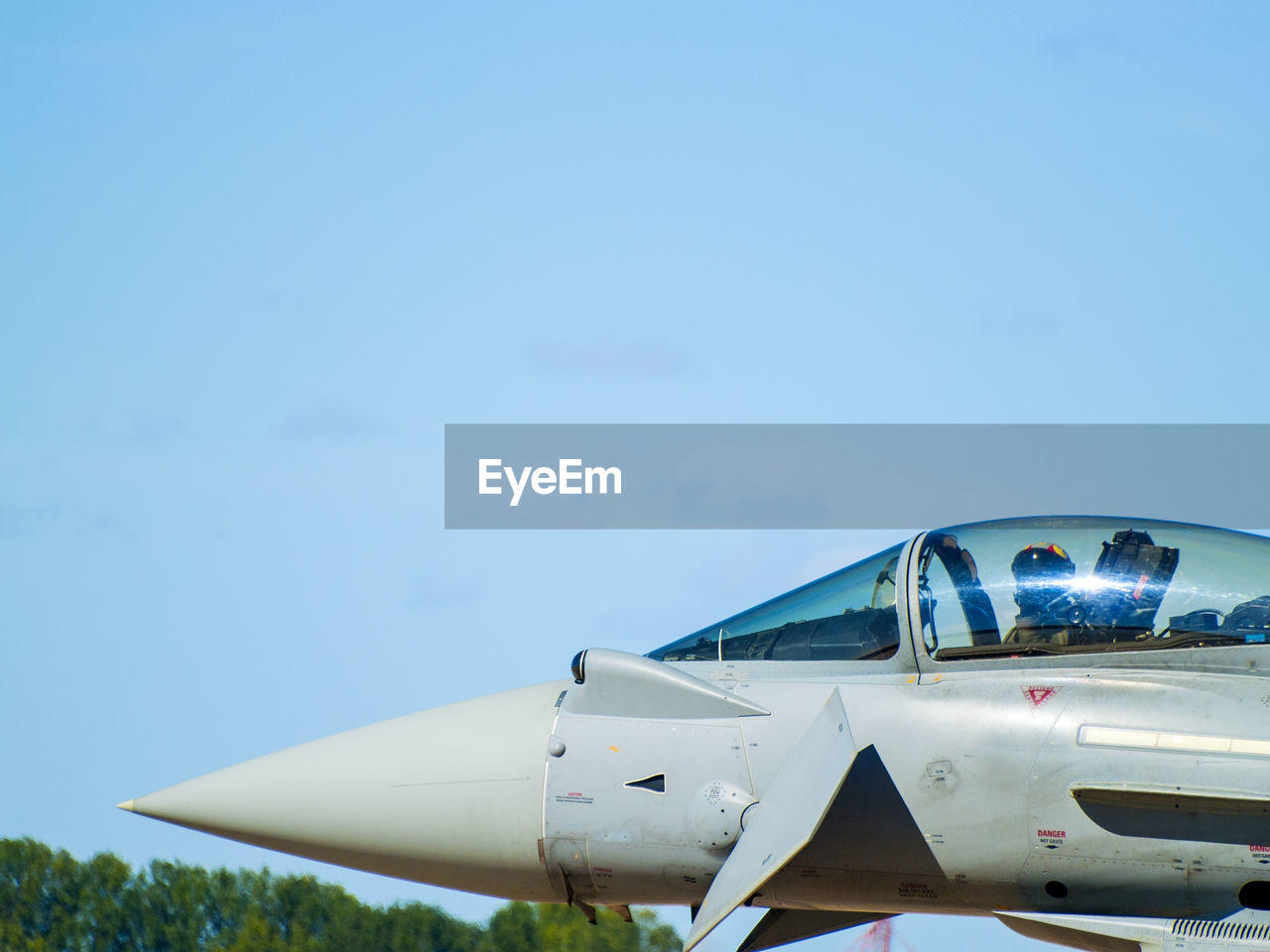 CLOSE-UP OF AIRPLANE OVER THE SKY