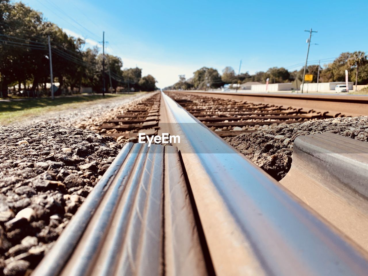 Surface level of railroad tracks against sky