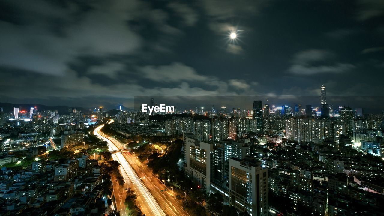 High angle view of illuminated city buildings at night