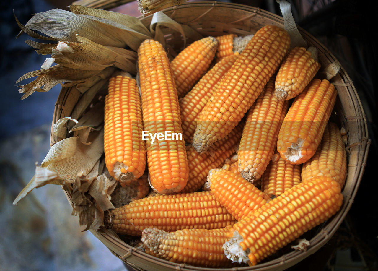 Close-up of corn kernel in rustic basket
