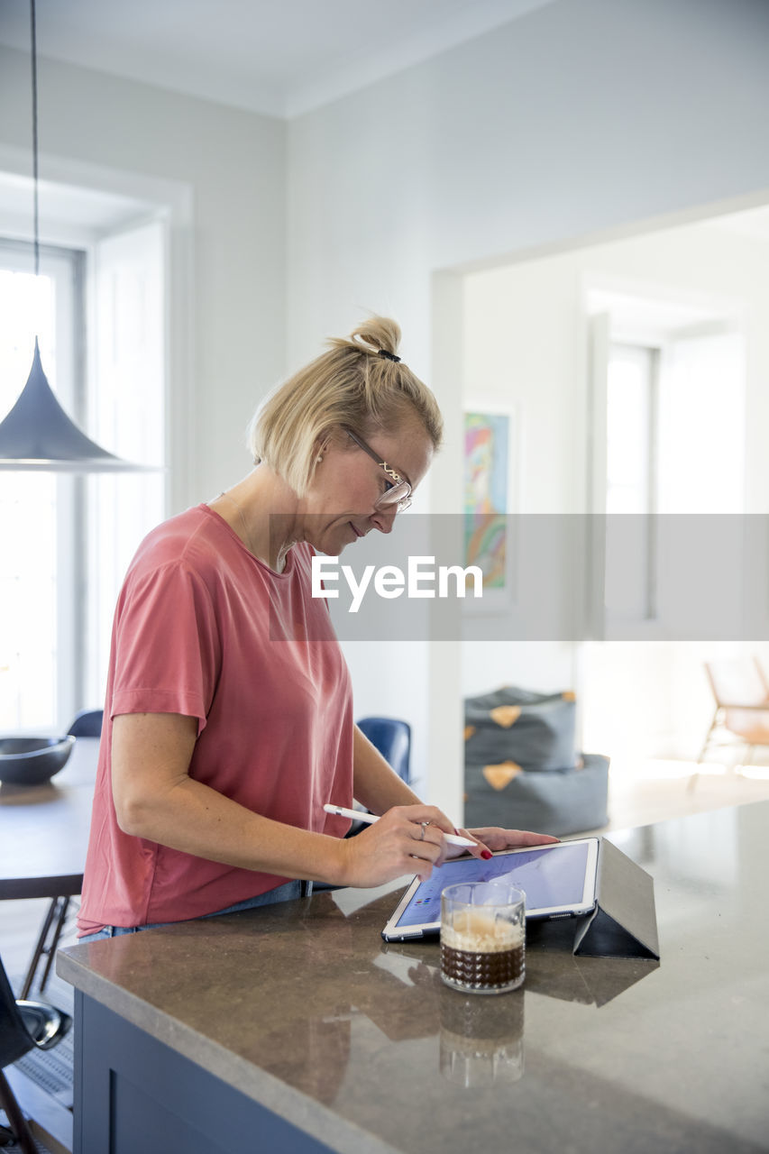 Woman using digital tablet