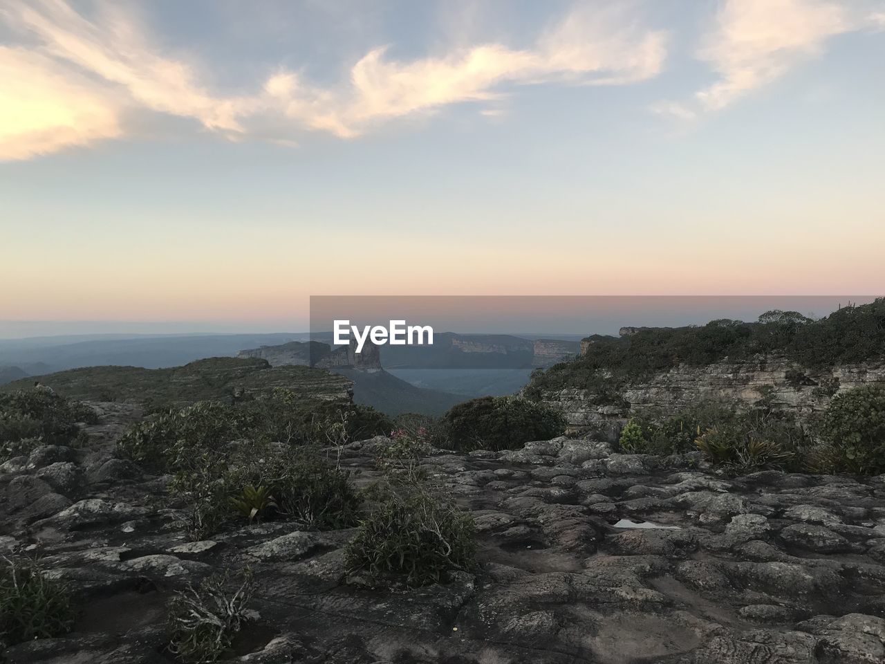 SCENIC VIEW OF MOUNTAINS AGAINST SKY AT SUNSET