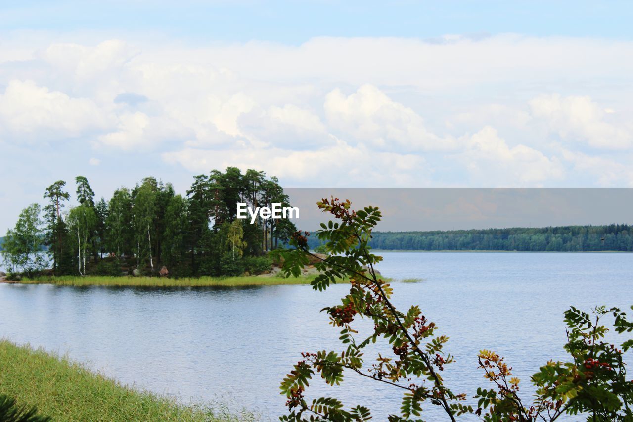 SCENIC VIEW OF LAKE AGAINST CLOUDY SKY