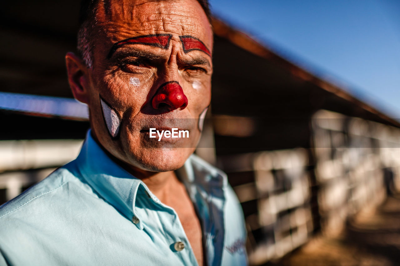 PORTRAIT OF SMILING MAN WEARING MASK