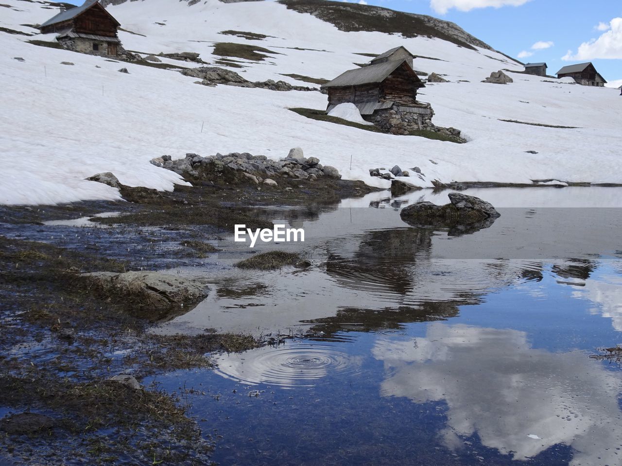 Scenic view of frozen lake against sky