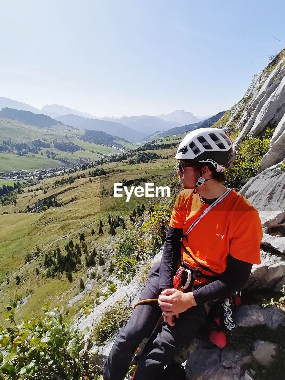 Young man sitting on mountain