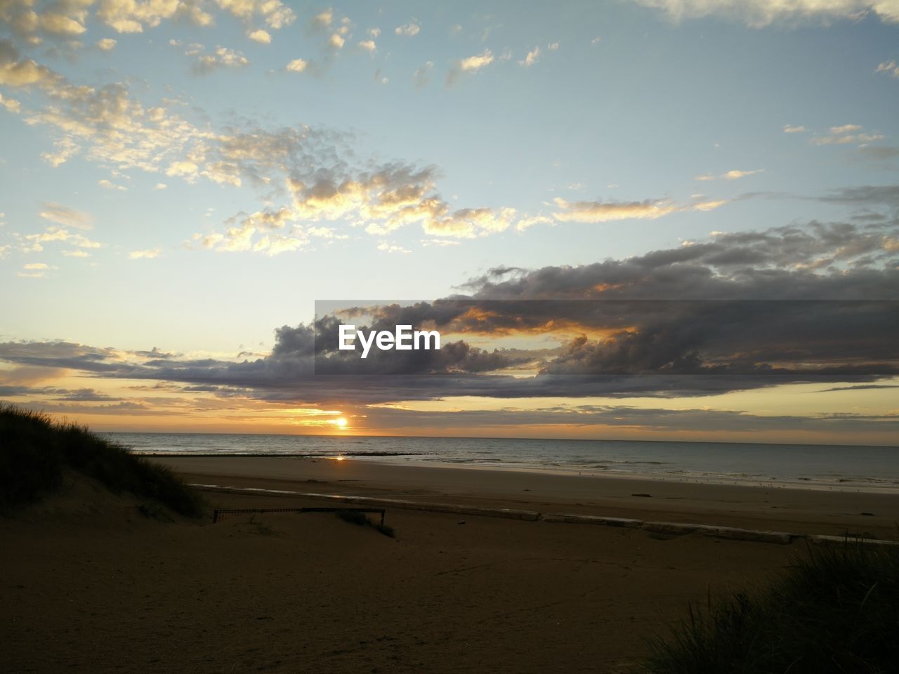 Scenic view of sea at sunset