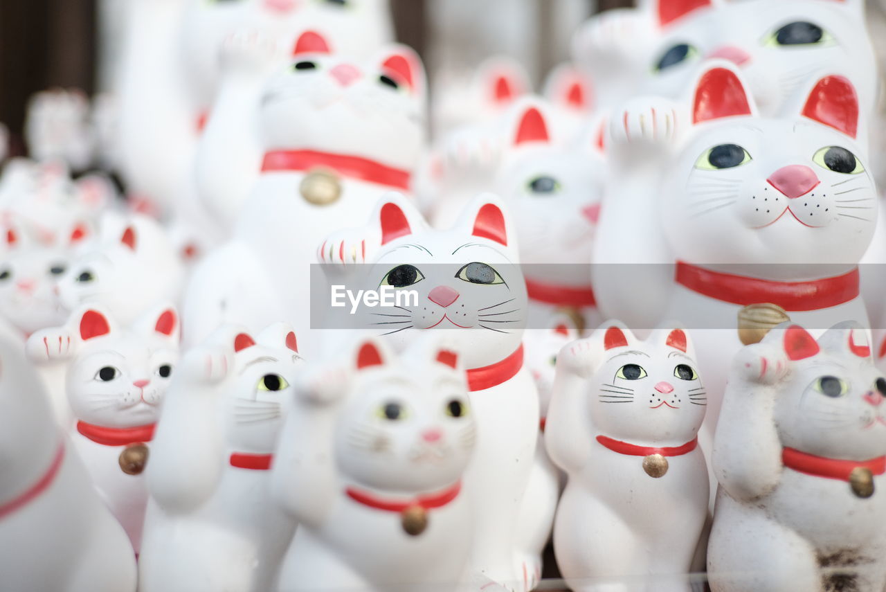 Close-up of cat figurines for sale in market