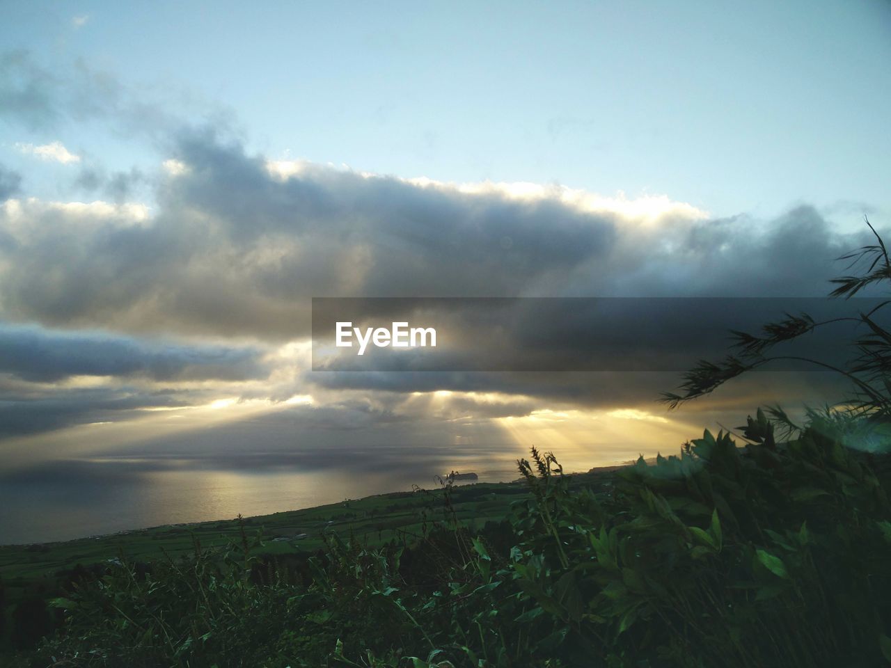 SCENIC VIEW OF LAND AGAINST SKY DURING SUNSET