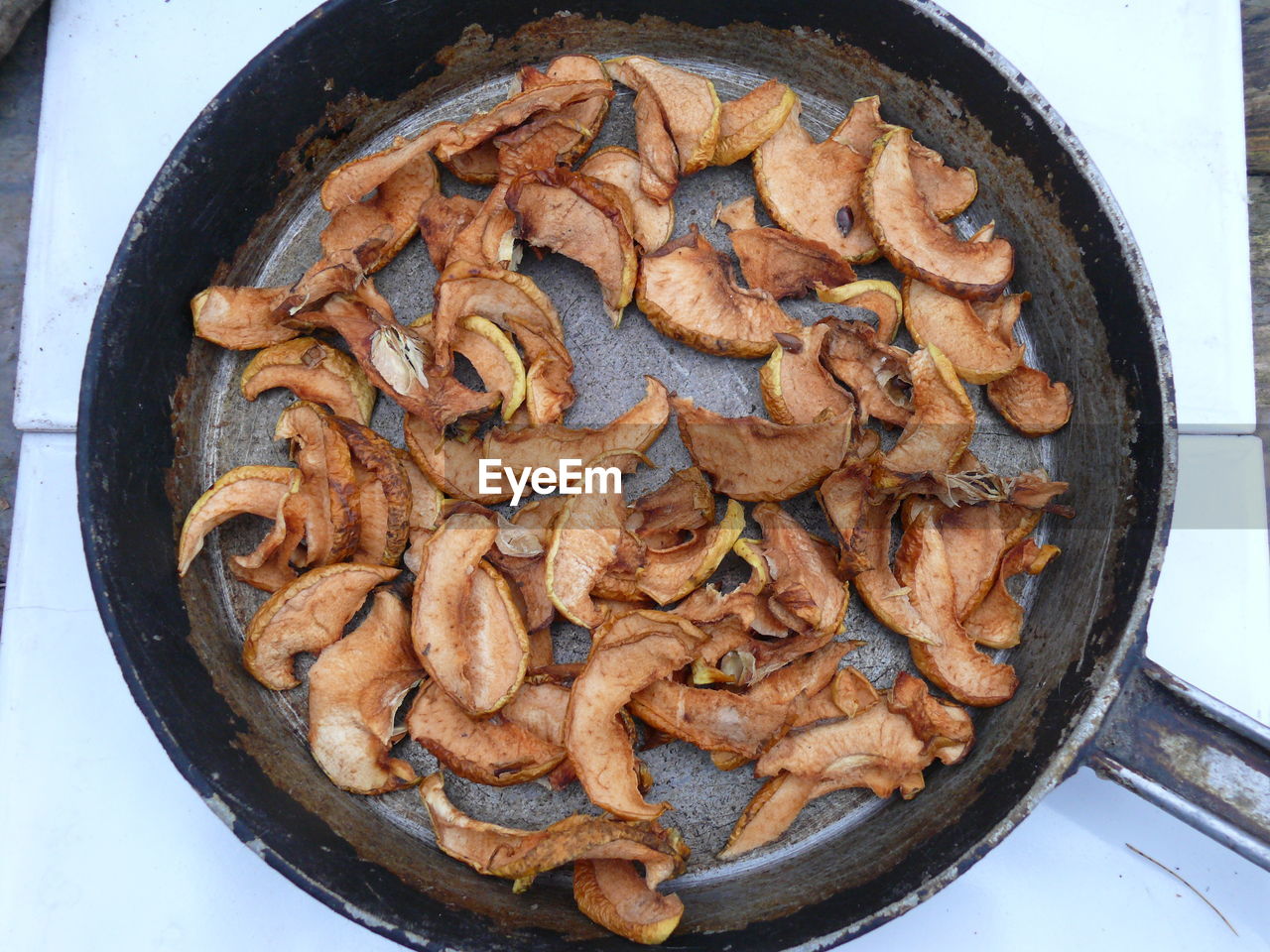 Dried apple slices in a cast iron pan