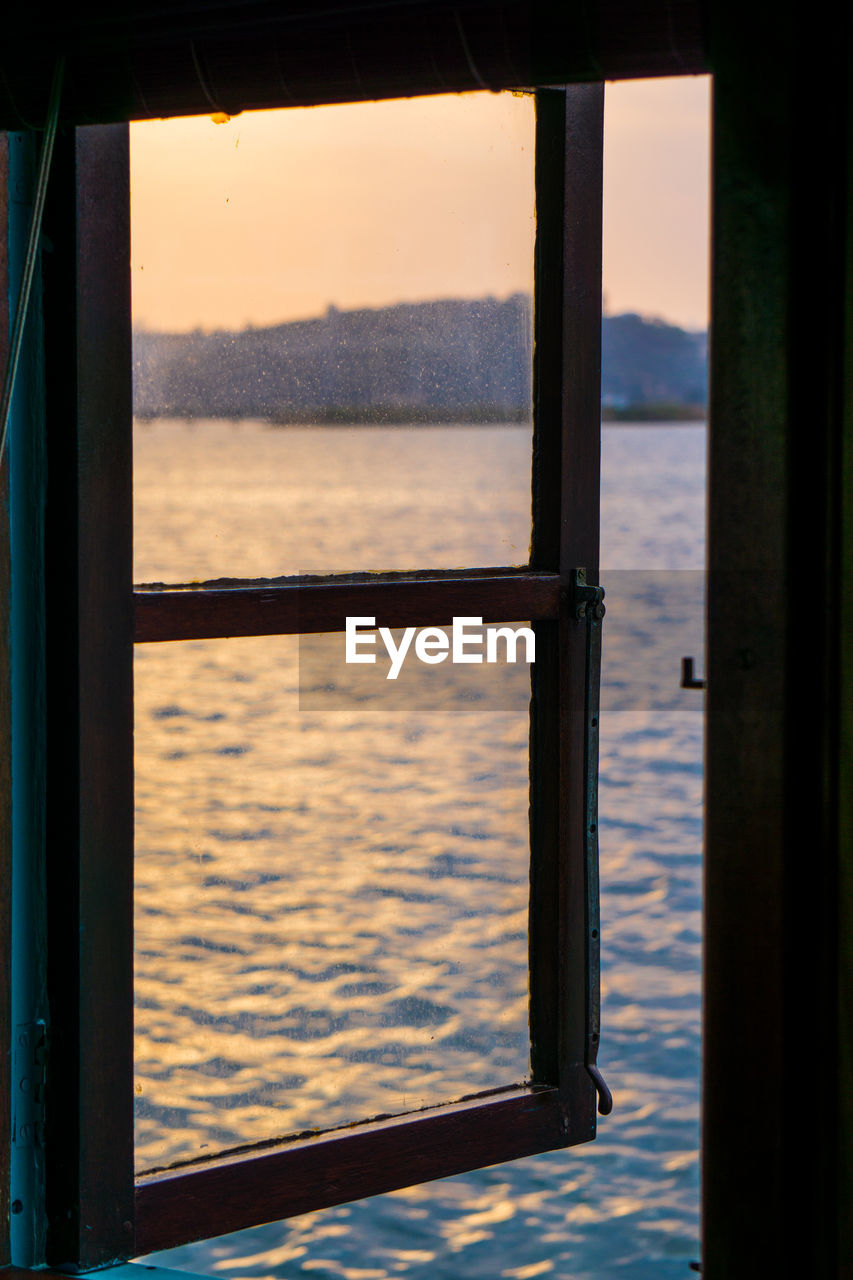 Scenic view of sea seen through window