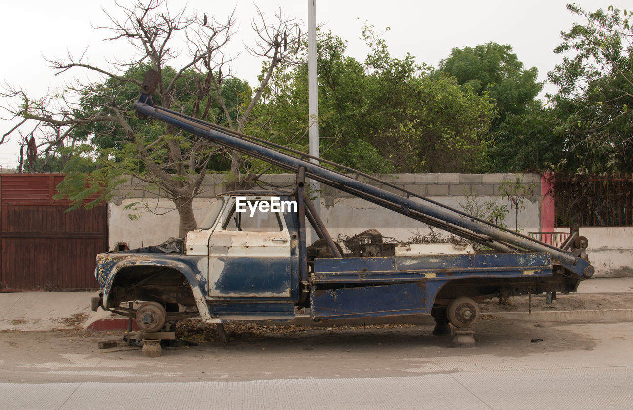 Abandoned pick-up truck on road