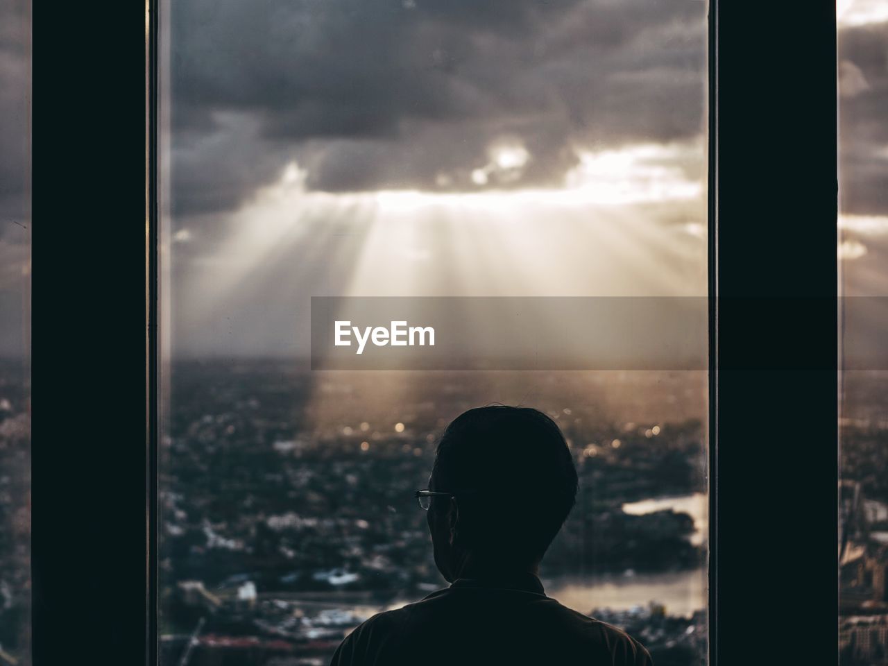 Rear view of man looking at cityscape while standing at sydney tower