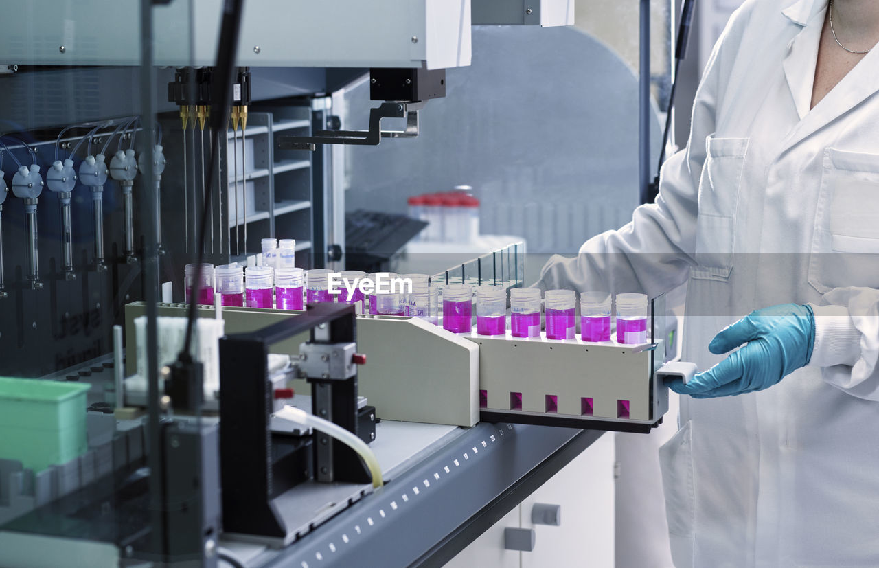 Scientist with medical sample in laboratory