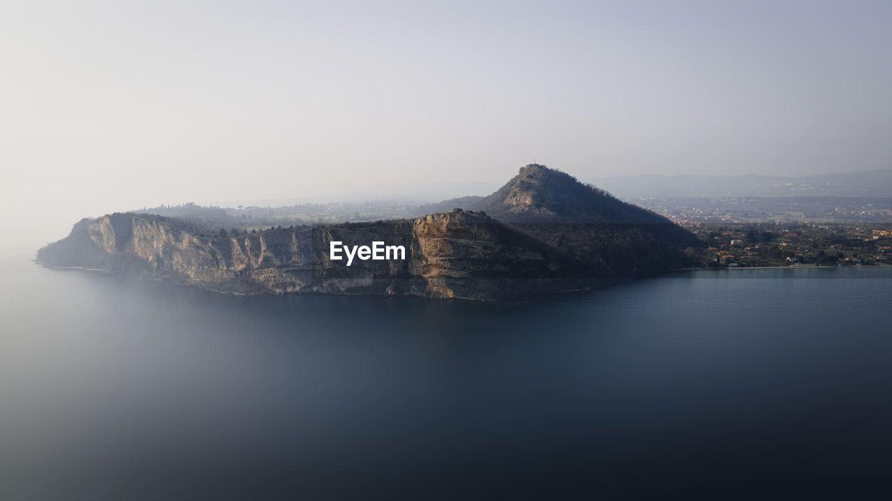 SCENIC VIEW OF SEA AND ROCK FORMATION AGAINST SKY