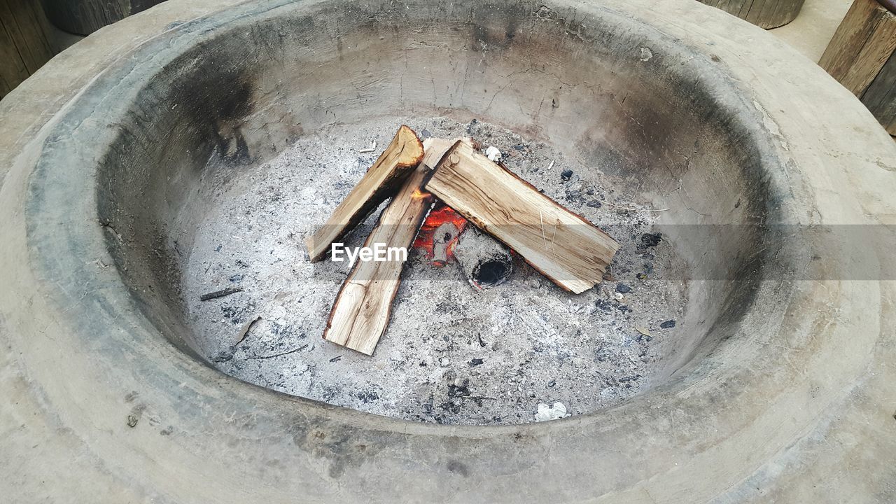 High angle view of logs in fire pit