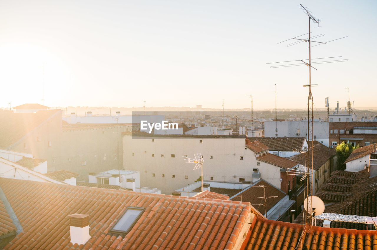 Cityscape against sky on sunny day