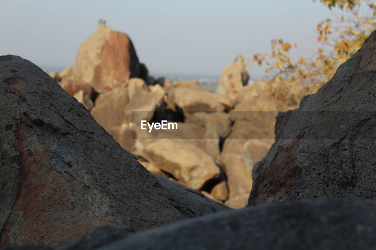 Close-up of rocks against clear sky