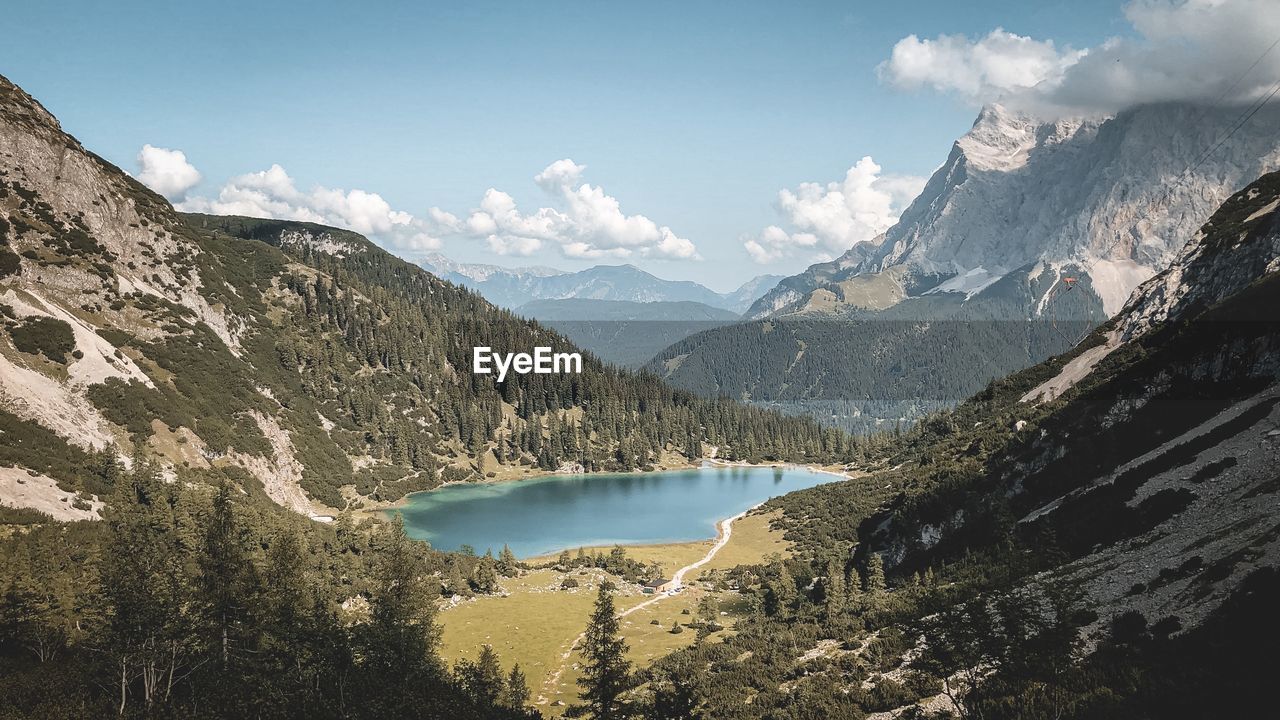 Panoramic view of lake and mountains against sky