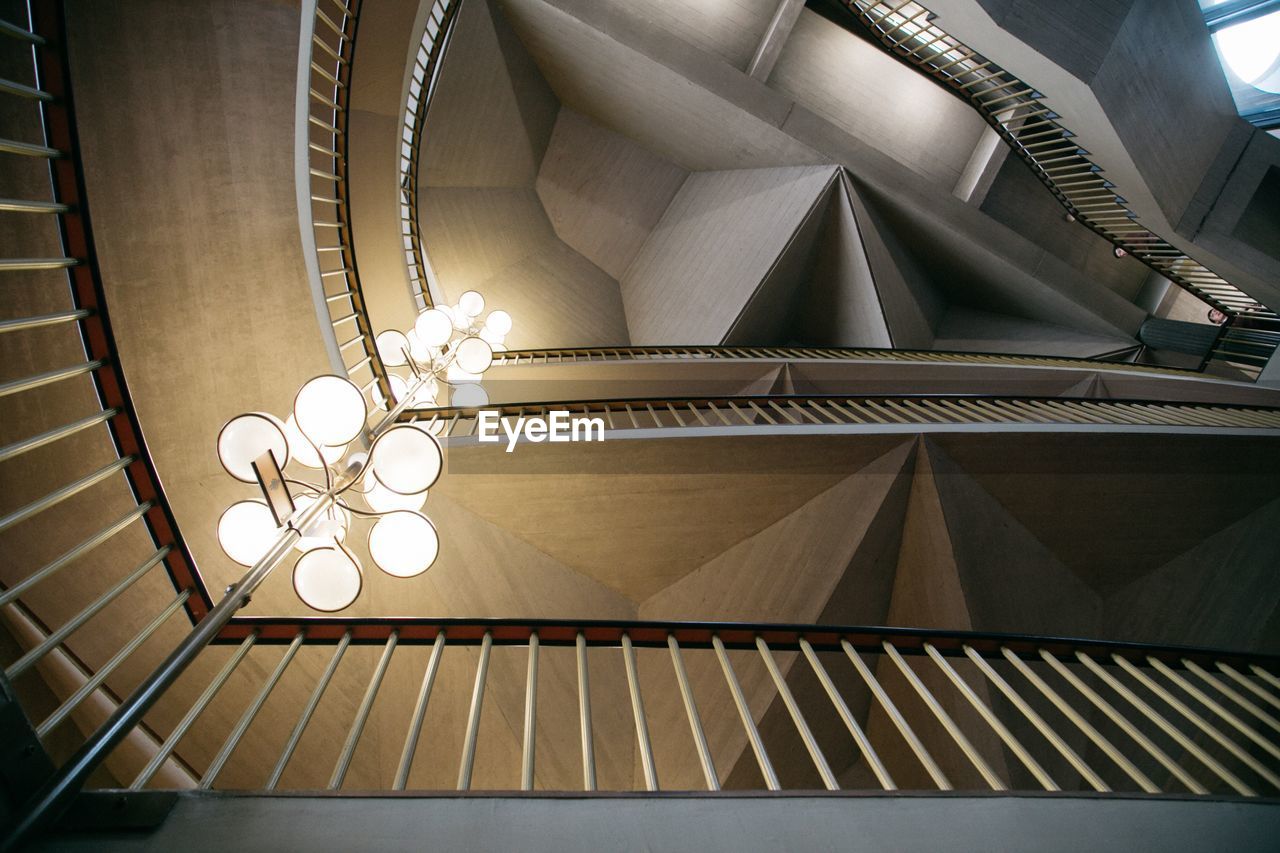 LOW ANGLE VIEW OF ILLUMINATED LIGHTS ON CEILING