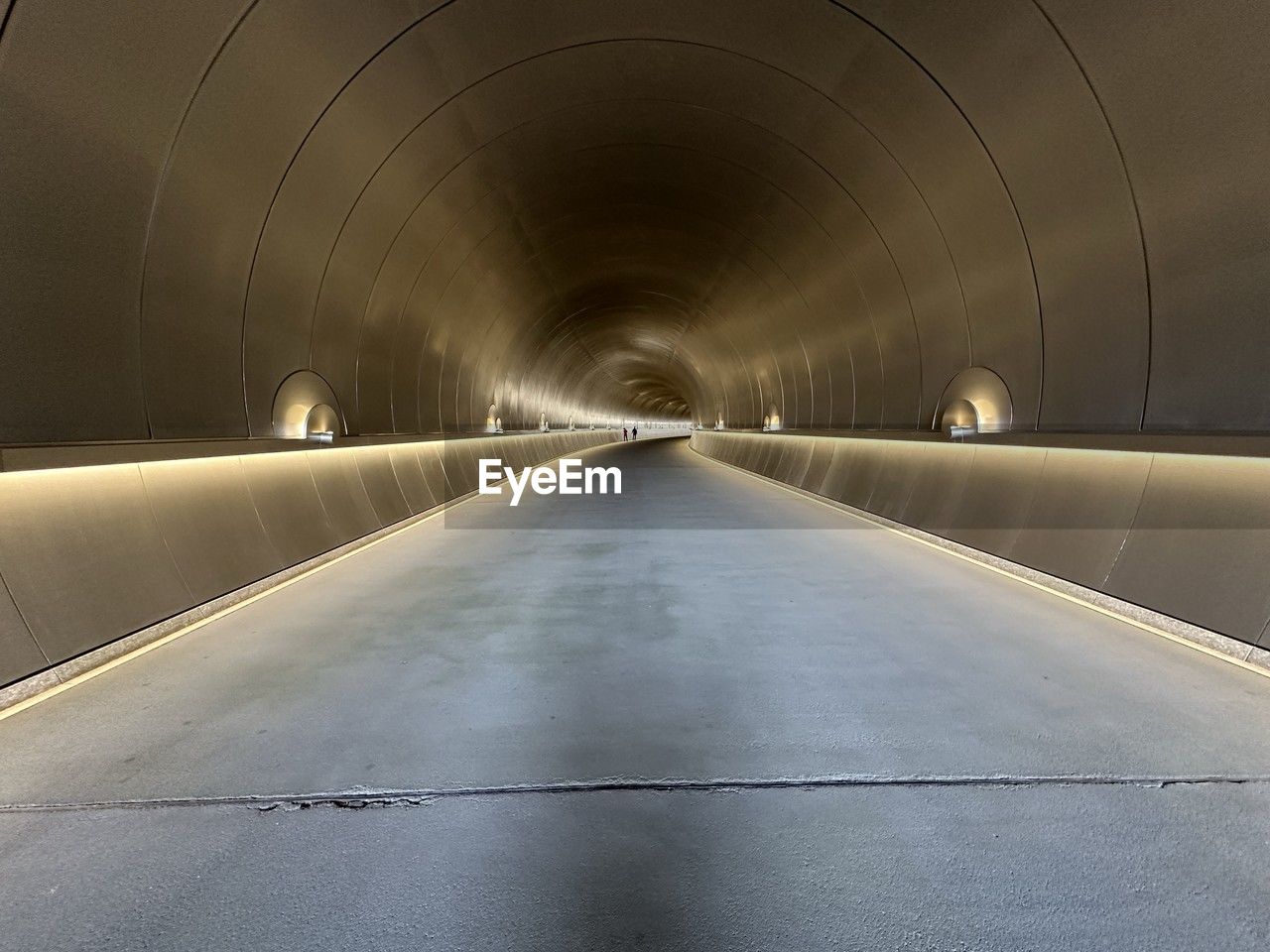 low angle view of illuminated tunnel