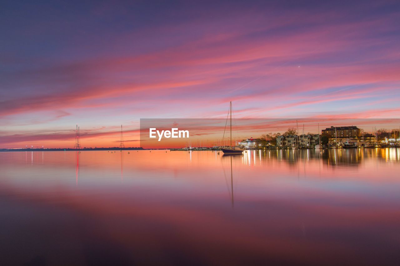 Scenic view of sea against sky at sunset