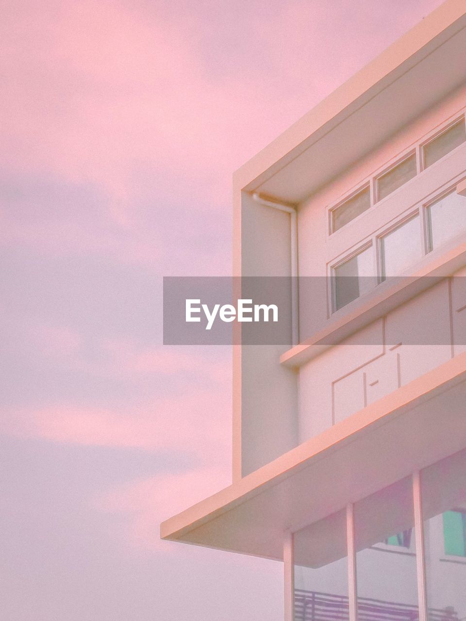 Low angle view of building against sky during sunset