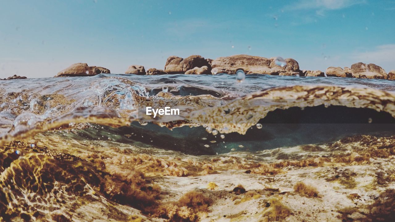 ROCK FORMATIONS ON BEACH