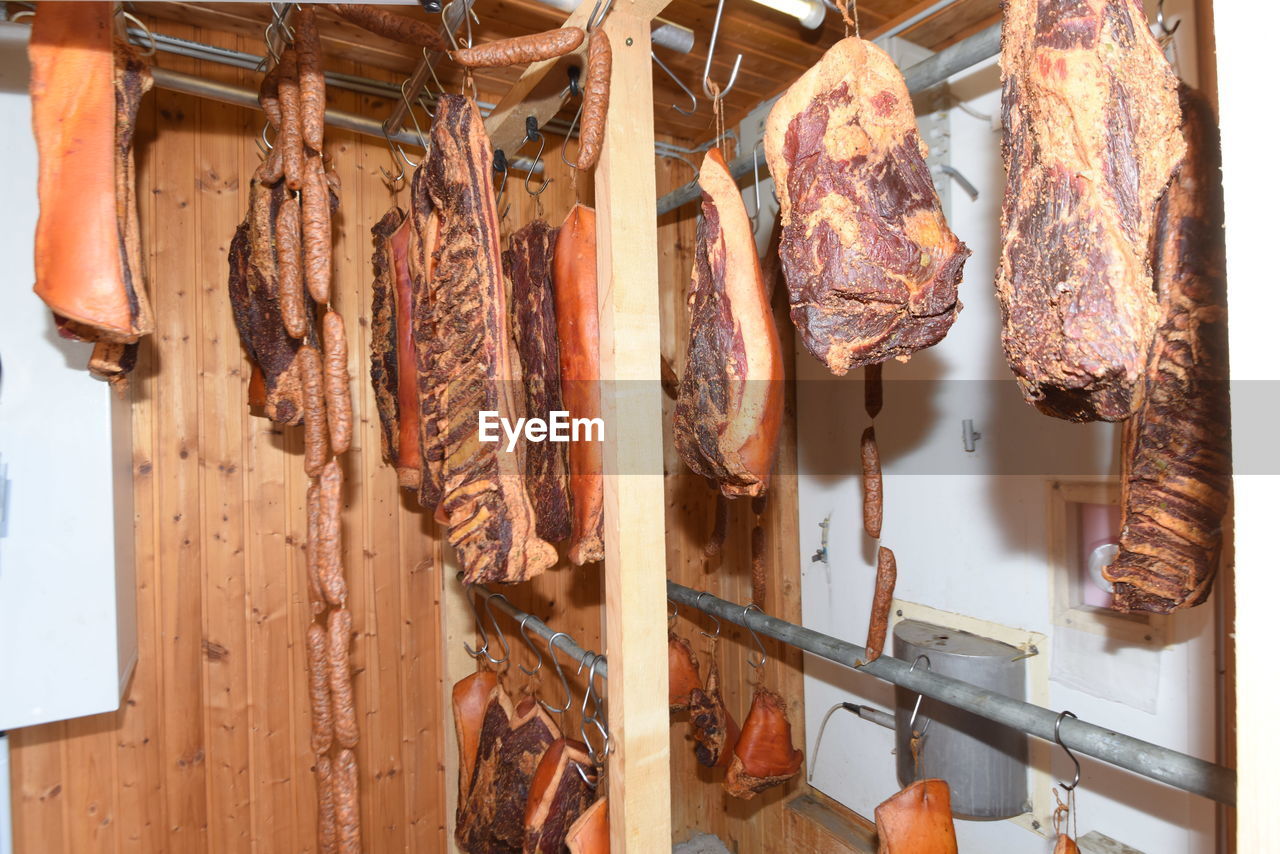 Ham in a smoking chamber, the process of refining meat