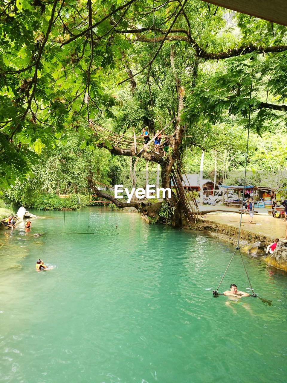 PEOPLE IN BOAT ON RIVER