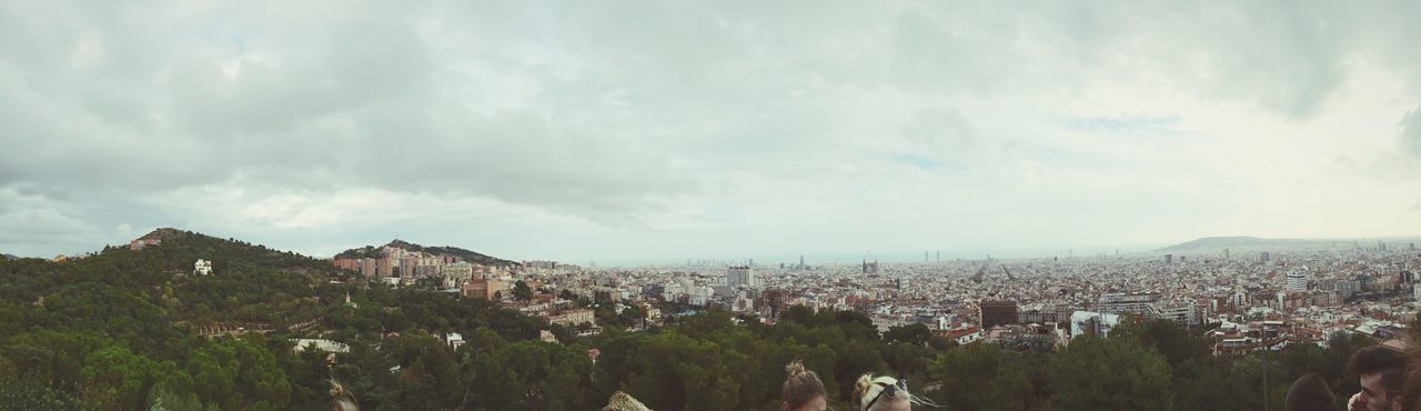 Panoramic view of park guell against cloudy sky