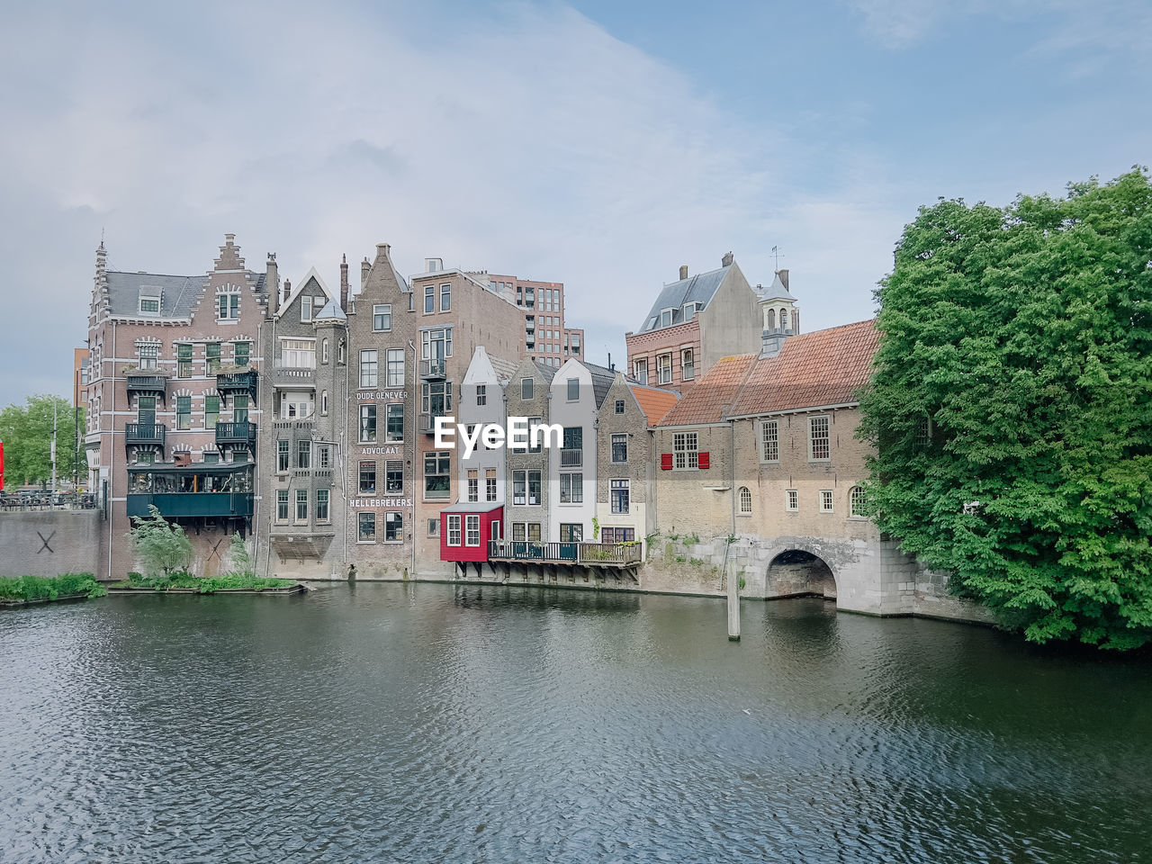 buildings by river in city