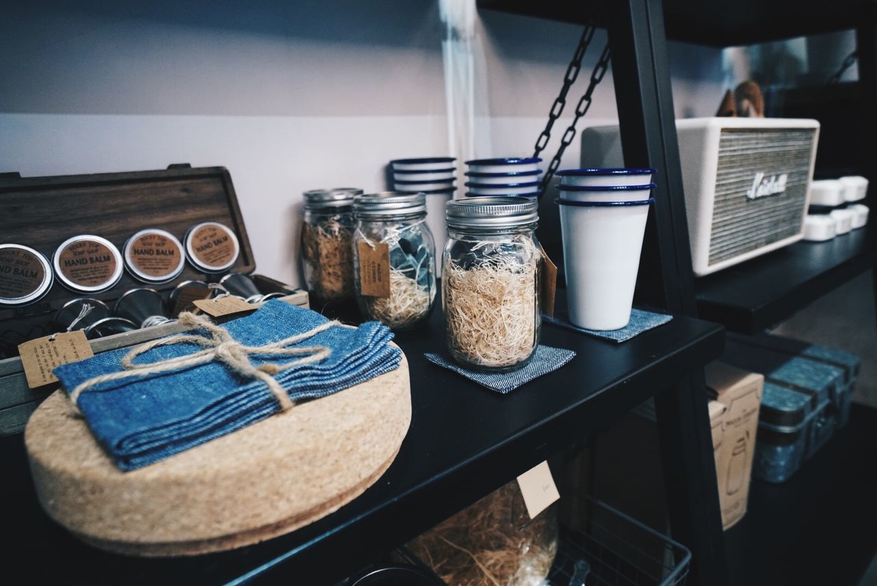 Close-up of food in jars and containers on shelf